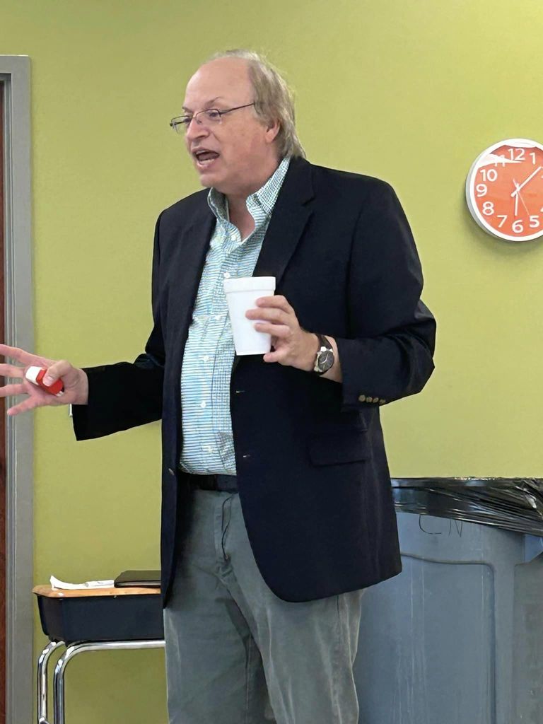 Dr J Allen Meadows lecturing